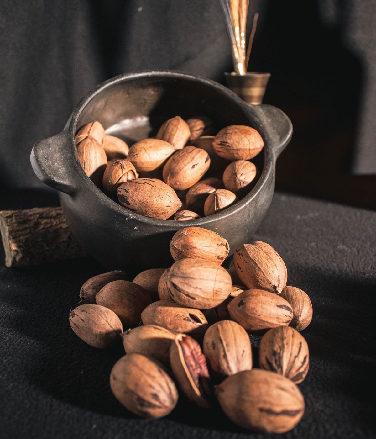 In-shell pecans under a spotlight